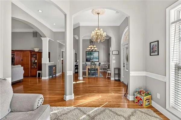 a lobby with furniture and wooden floor