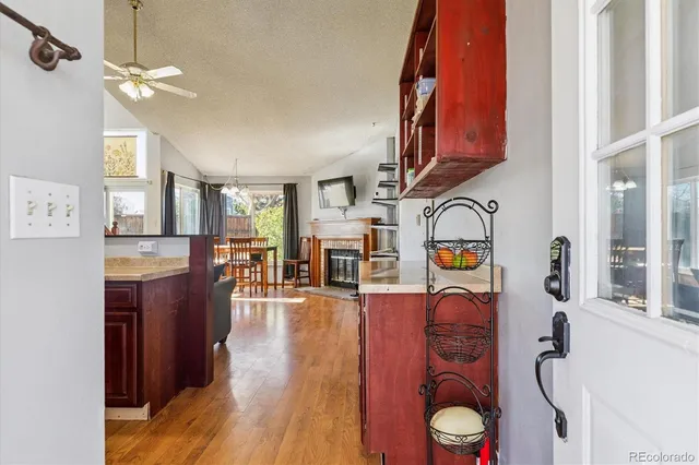 a view of living room kitchen and entryway