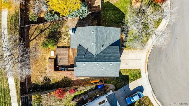 an aerial view of a house with a yard
