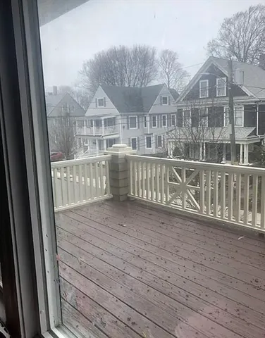 a view of a house with wooden deck