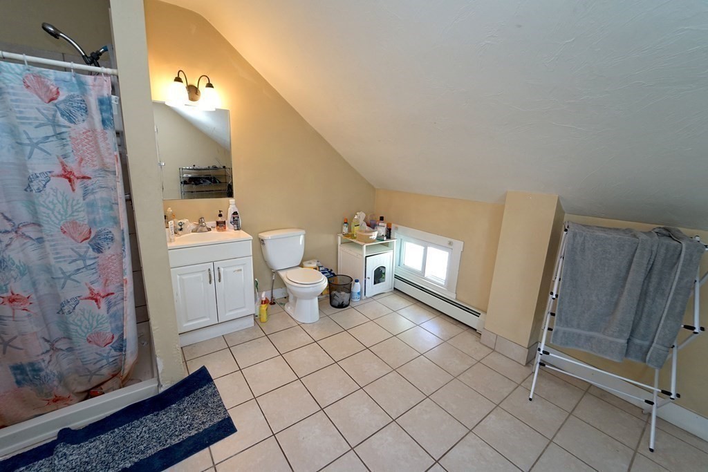 22 Coral Street Fall River, MA 02721 - Photo 15 of 23 a bathroom with a sink mirror and toilet