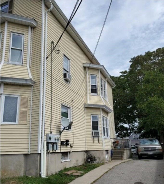 22 Coral Street Fall River, MA 02721 - Photo 2 of 23 a view of multiple house with garage