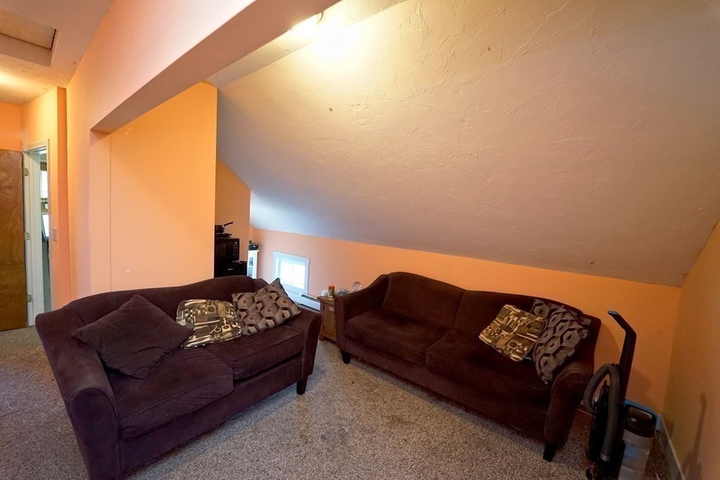 22 Coral Street Fall River, MA 02721 - Photo 21 of 23 a living room with furniture and a window