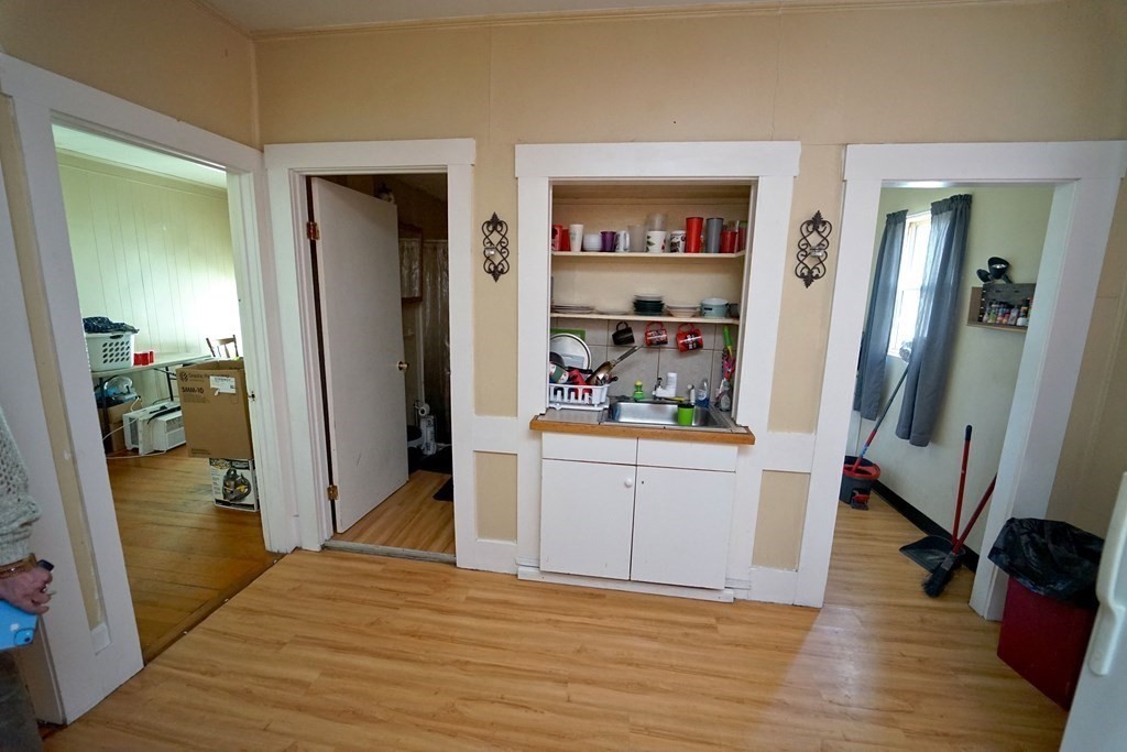 22 Coral Street Fall River, MA 02721 - Photo 3 of 23 a view of kitchen with stainless steel appliances wooden floor