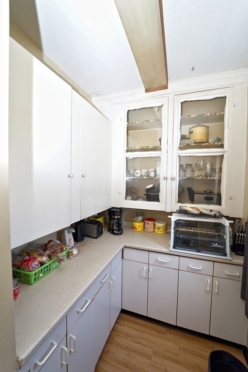 22 Coral Street Fall River, MA 02721 - Photo 4 of 23 a kitchen with a sink and cabinets