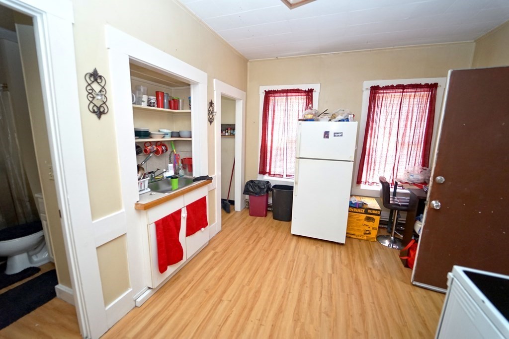 22 Coral Street Fall River, MA 02721 - Photo 5 of 23 a kitchen with stainless steel appliances a refrigerator and a stove