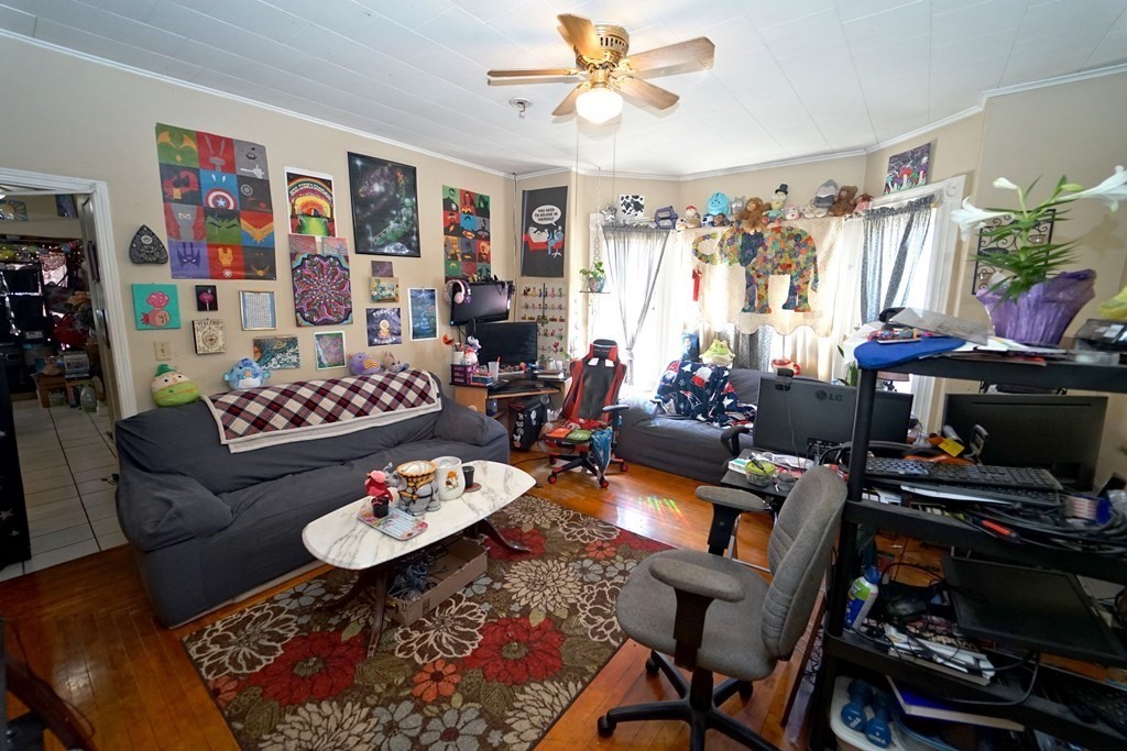 22 Coral Street Fall River, MA 02721 - Photo 6 of 23 a living room with furniture and a flat screen tv