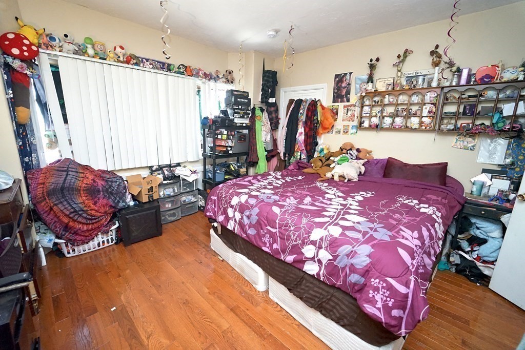 22 Coral Street Fall River, MA 02721 - Photo 9 of 23 a bed room with a bed and a couch