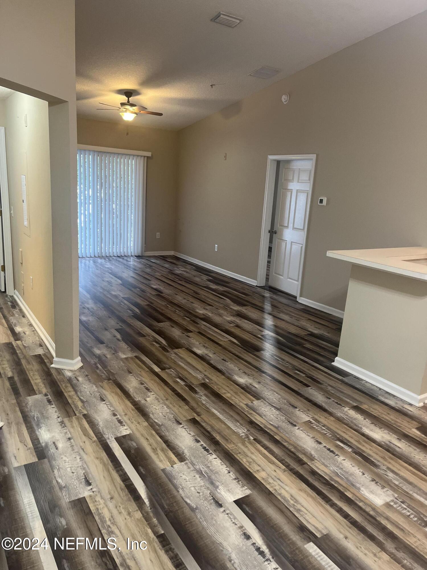 6069 Maggies Circle, Unit 112 Jacksonville, FL 32244 - Photo 2 of 11 a view of a room with wooden floor