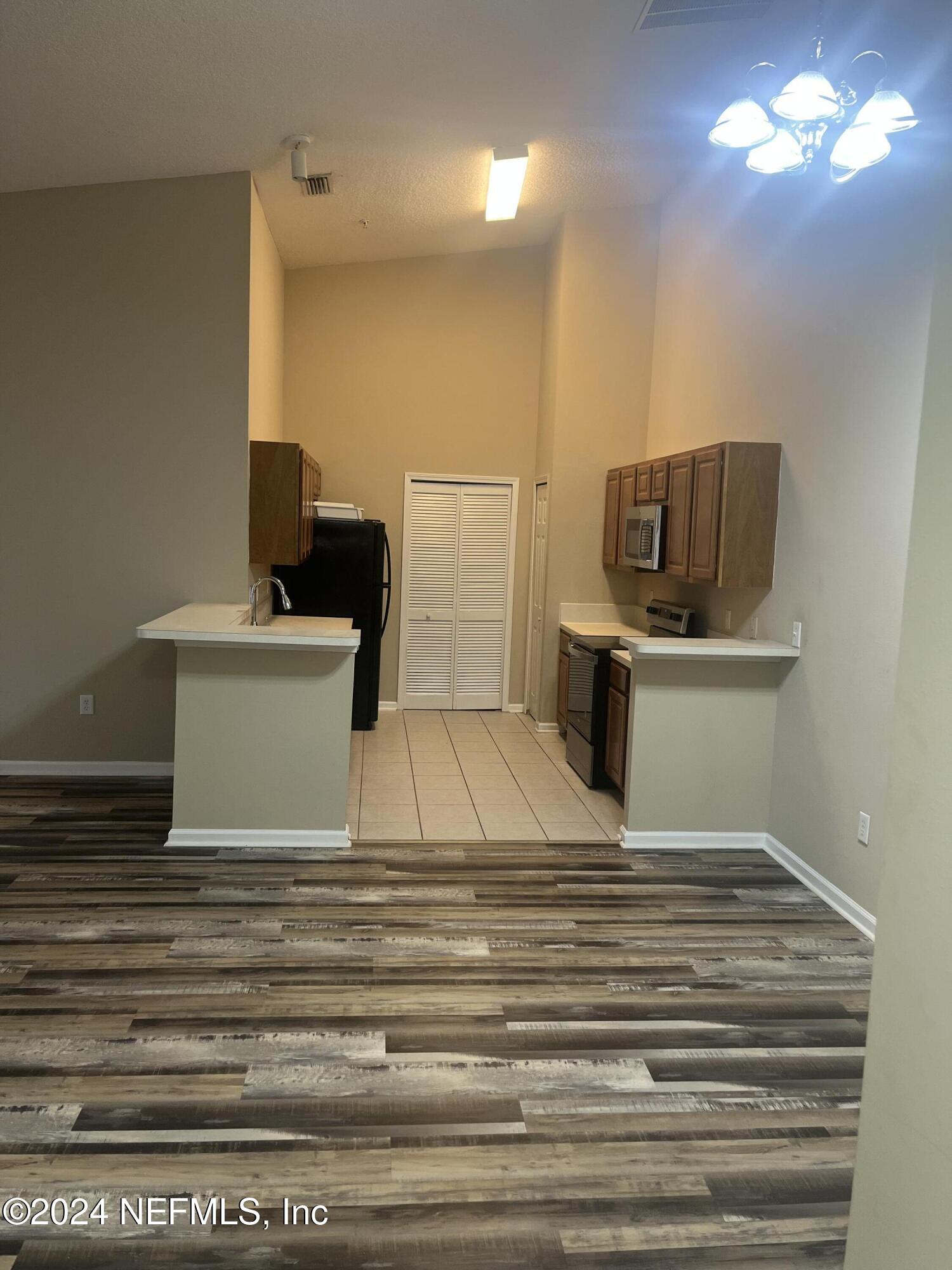 6069 Maggies Circle, Unit 112 Jacksonville, FL 32244 - Photo 3 of 11 a bathroom with a sink and a mirror