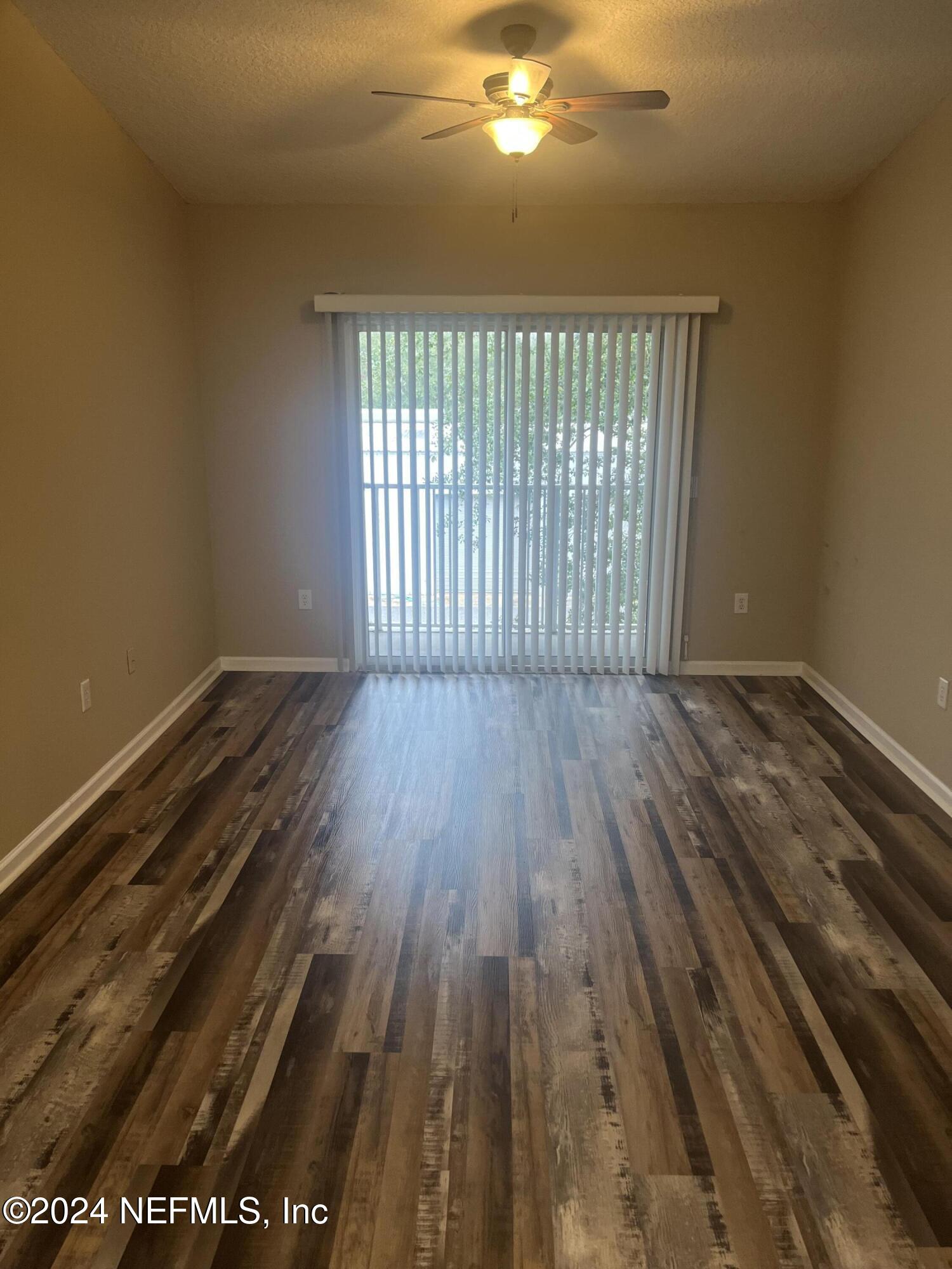 6069 Maggies Circle, Unit 112 Jacksonville, FL 32244 - Photo 5 of 11 a view of a room with wooden floor