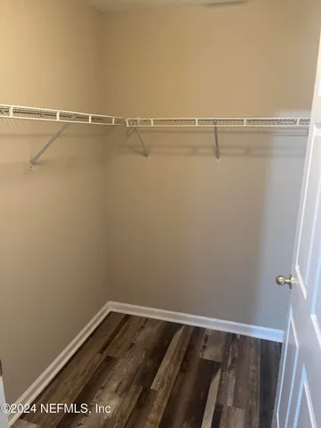 a view of a room with racks on the wall