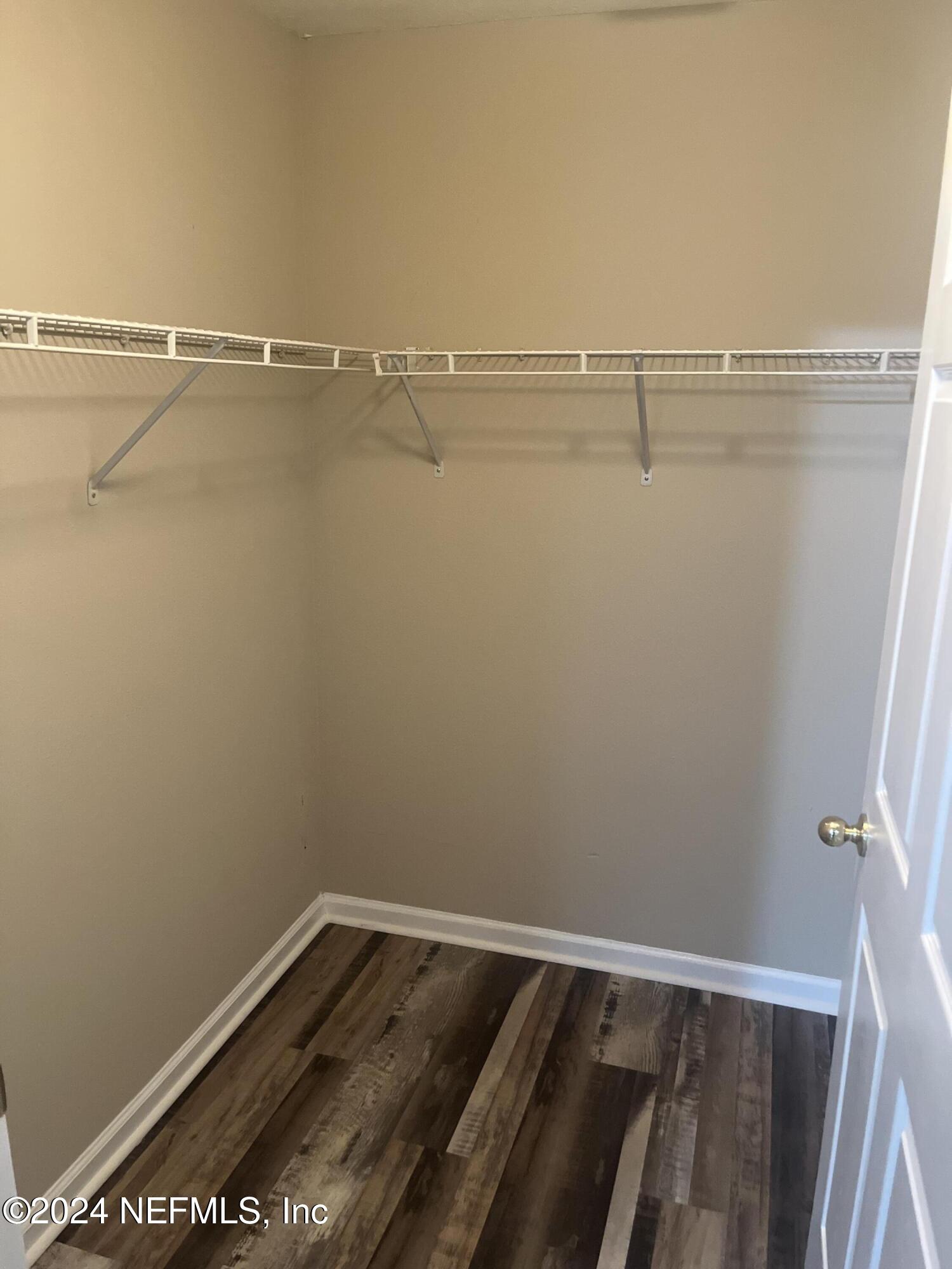 6069 Maggies Circle, Unit 112 Jacksonville, FL 32244 - Photo 8 of 11 a view of a room with racks on the wall