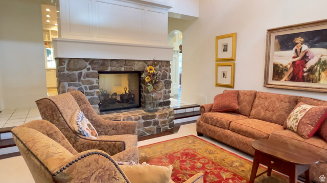 426 West Center Street Parowan, UT 84761 - Photo 36 of 107 Living area featuring a floor-to-ceiling stone fireplace with a white mantel and paneling