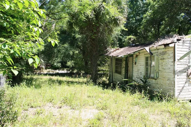 a backyard of a house with lots of green space