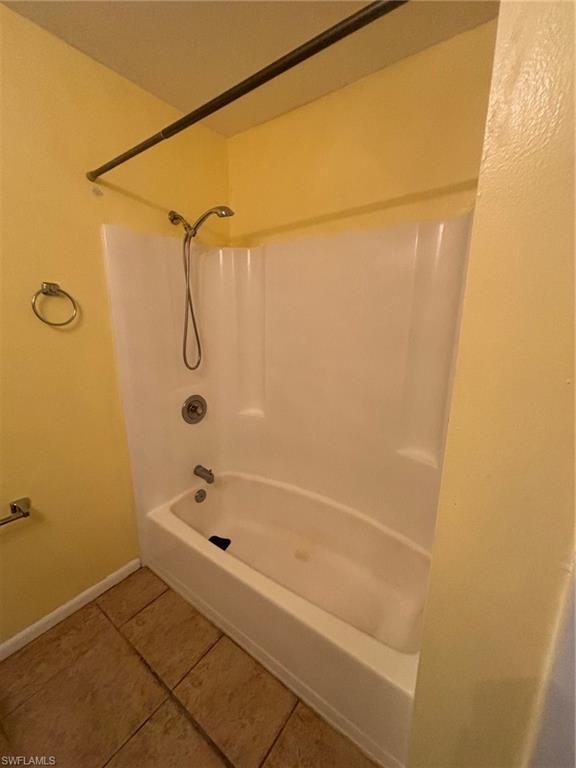 5386 16th Place Southwest, Unit F4 Naples, FL 34116 - Photo 9 of 11 a bathroom with a bathtub
