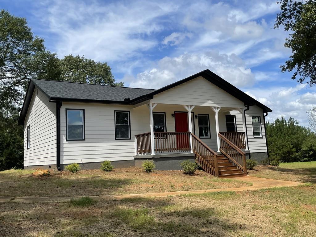 570 Stateline Road Bowdon, GA 30108 - Photo 1 of 1 a front view of a house with garden