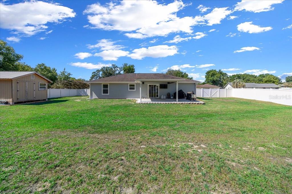 13 Teak Loop Place Ocala, FL 34472 - Photo 10 of 36 a view of a house with a big yard