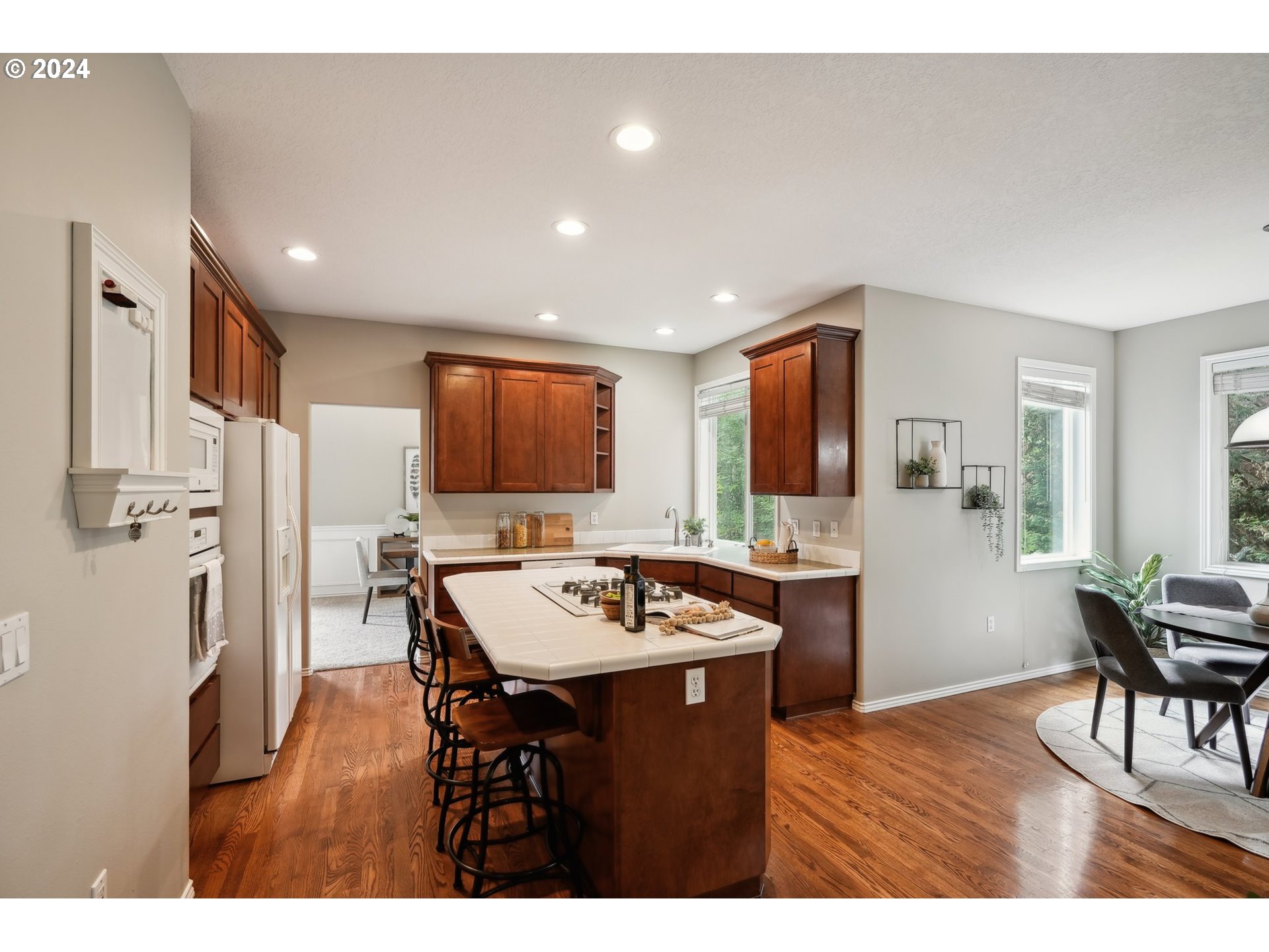 9267 Southwest 83rd Place Portland, OR 97223 - Photo 12 of 44 a kitchen with a table and chairs in it