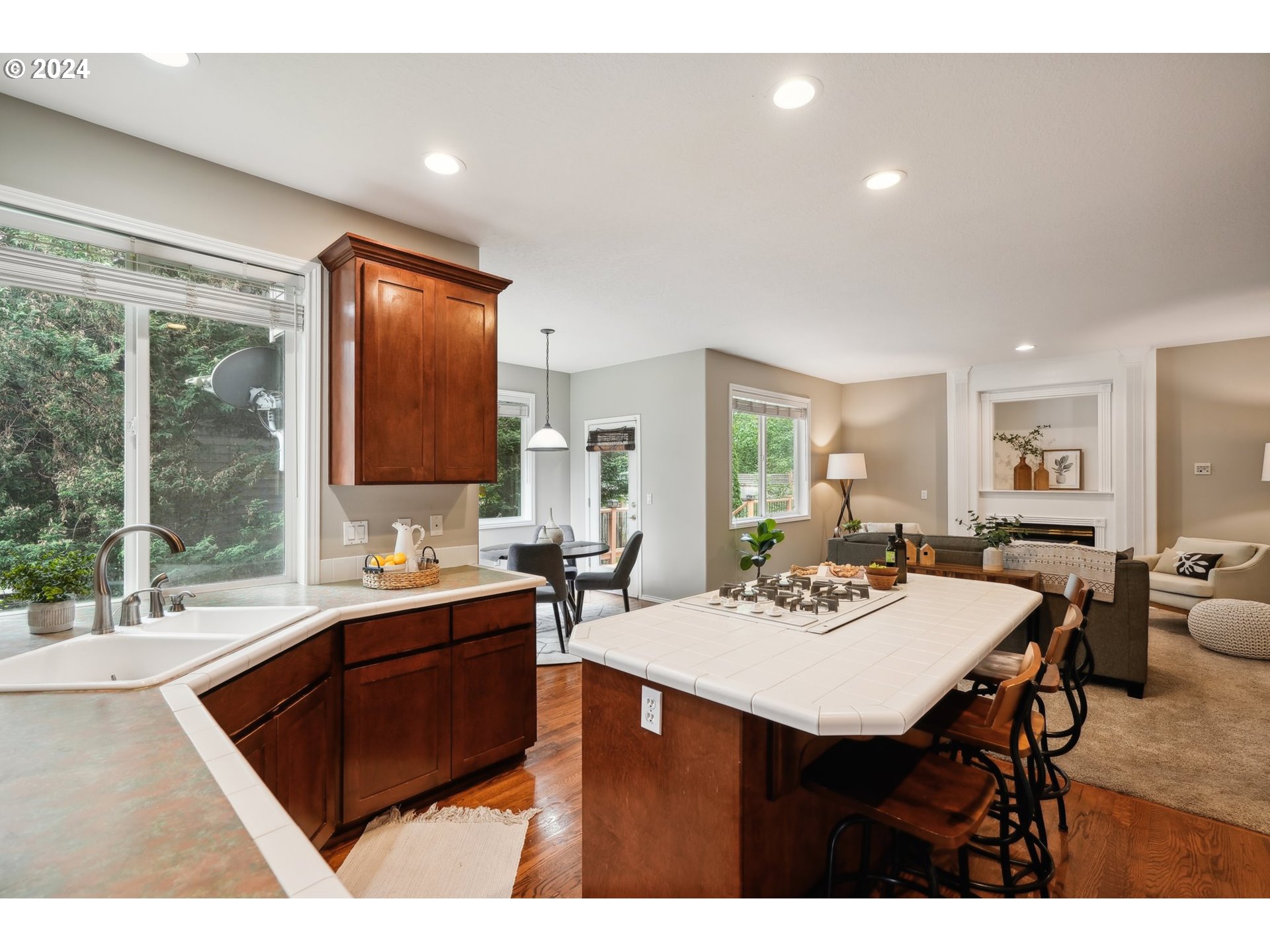 9267 Southwest 83rd Place Portland, OR 97223 - Photo 13 of 44 a kitchen with a sink and cabinets