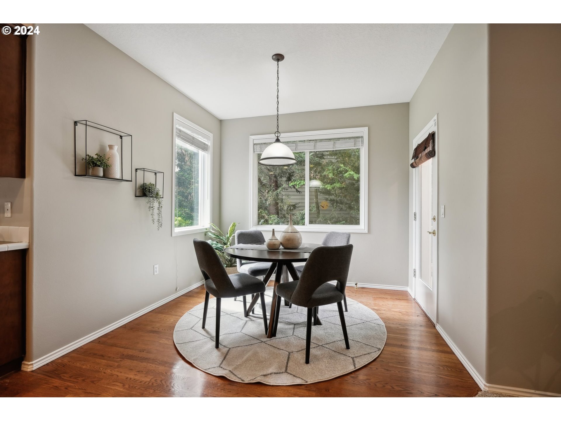 9267 Southwest 83rd Place Portland, OR 97223 - Photo 14 of 44 a view of a dining room with furniture window and wooden floor