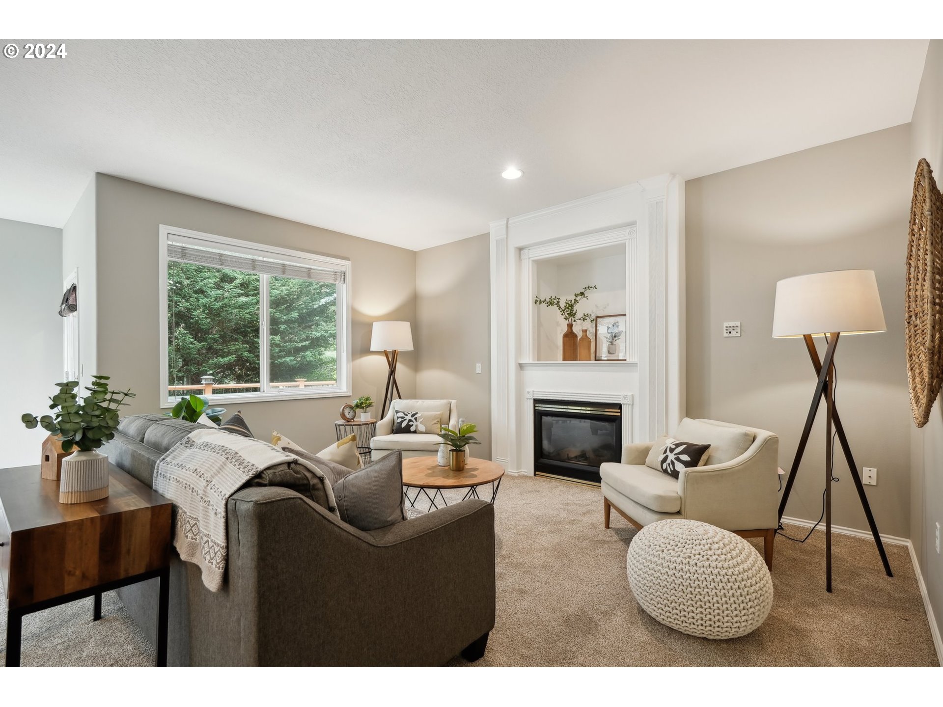 9267 Southwest 83rd Place Portland, OR 97223 - Photo 16 of 44 a living room with furniture a fireplace and a floor to ceiling window