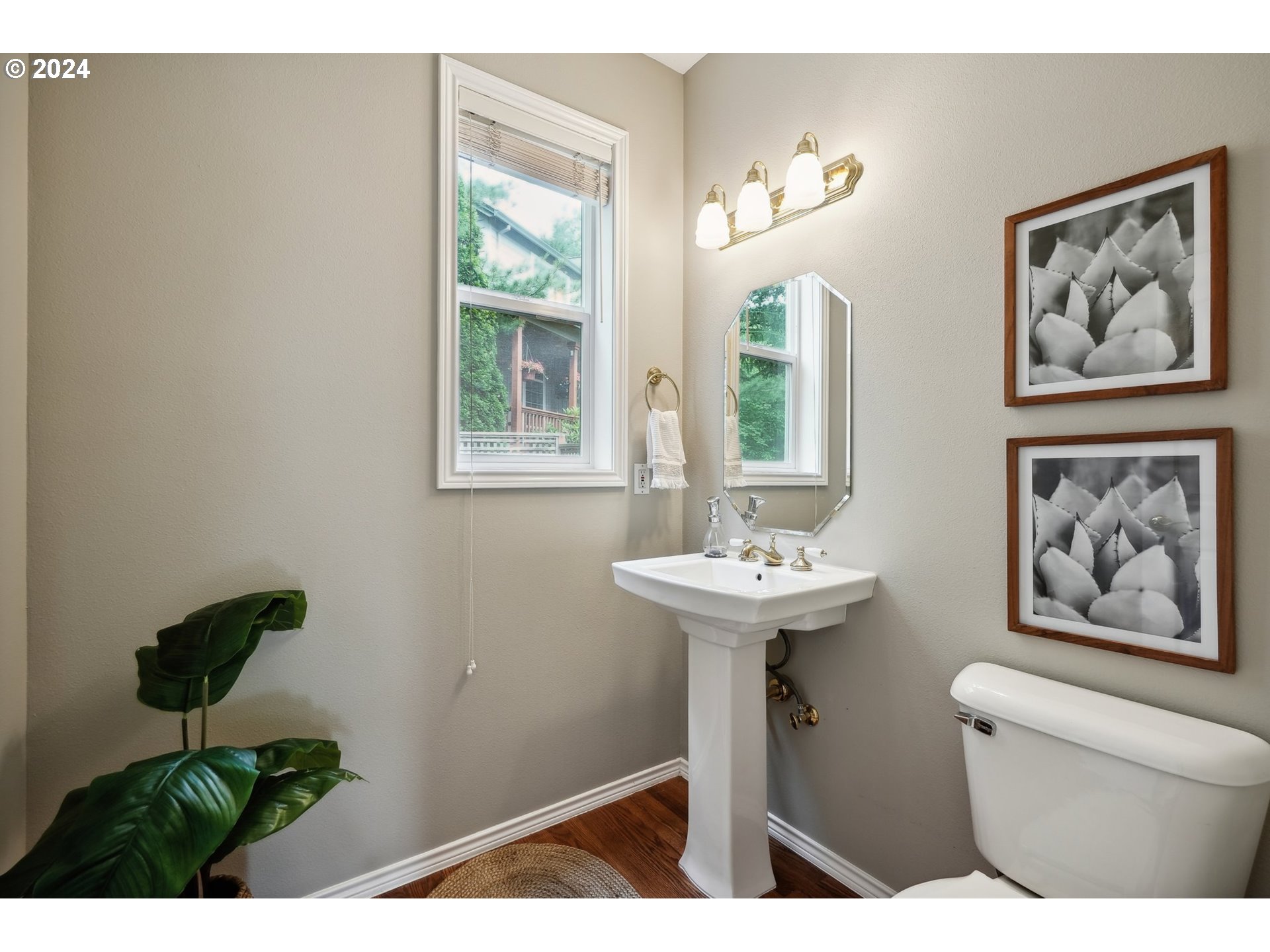 9267 Southwest 83rd Place Portland, OR 97223 - Photo 20 of 44 a bathroom with a sink a toilet and a window