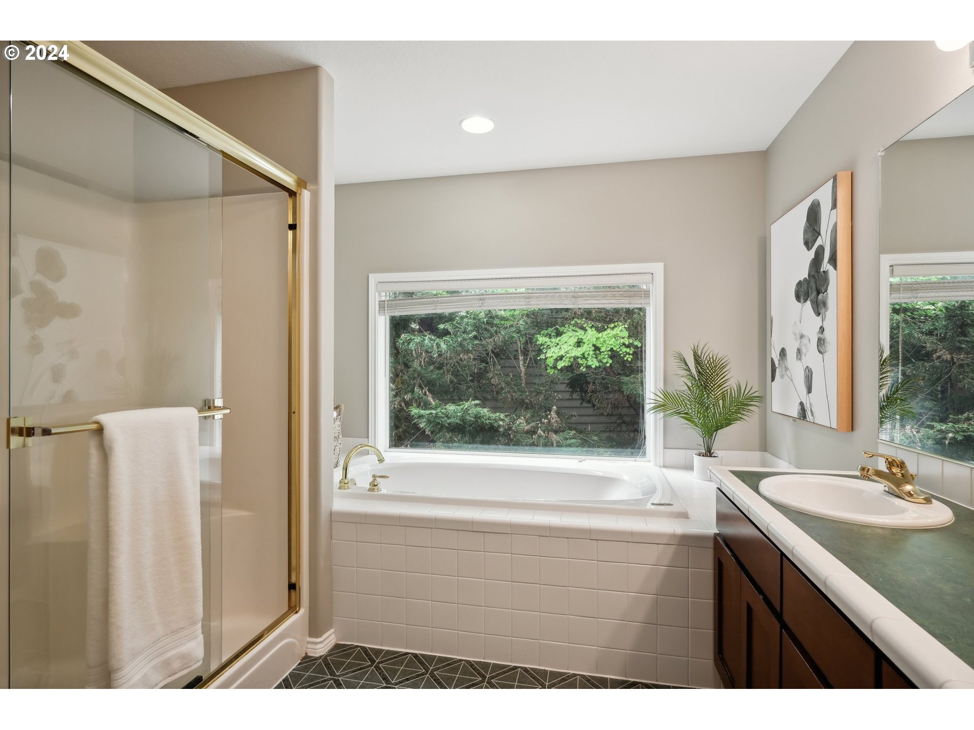 9267 Southwest 83rd Place Portland, OR 97223 - Photo 28 of 44 a bathroom with a sink a bathtub and a sink
