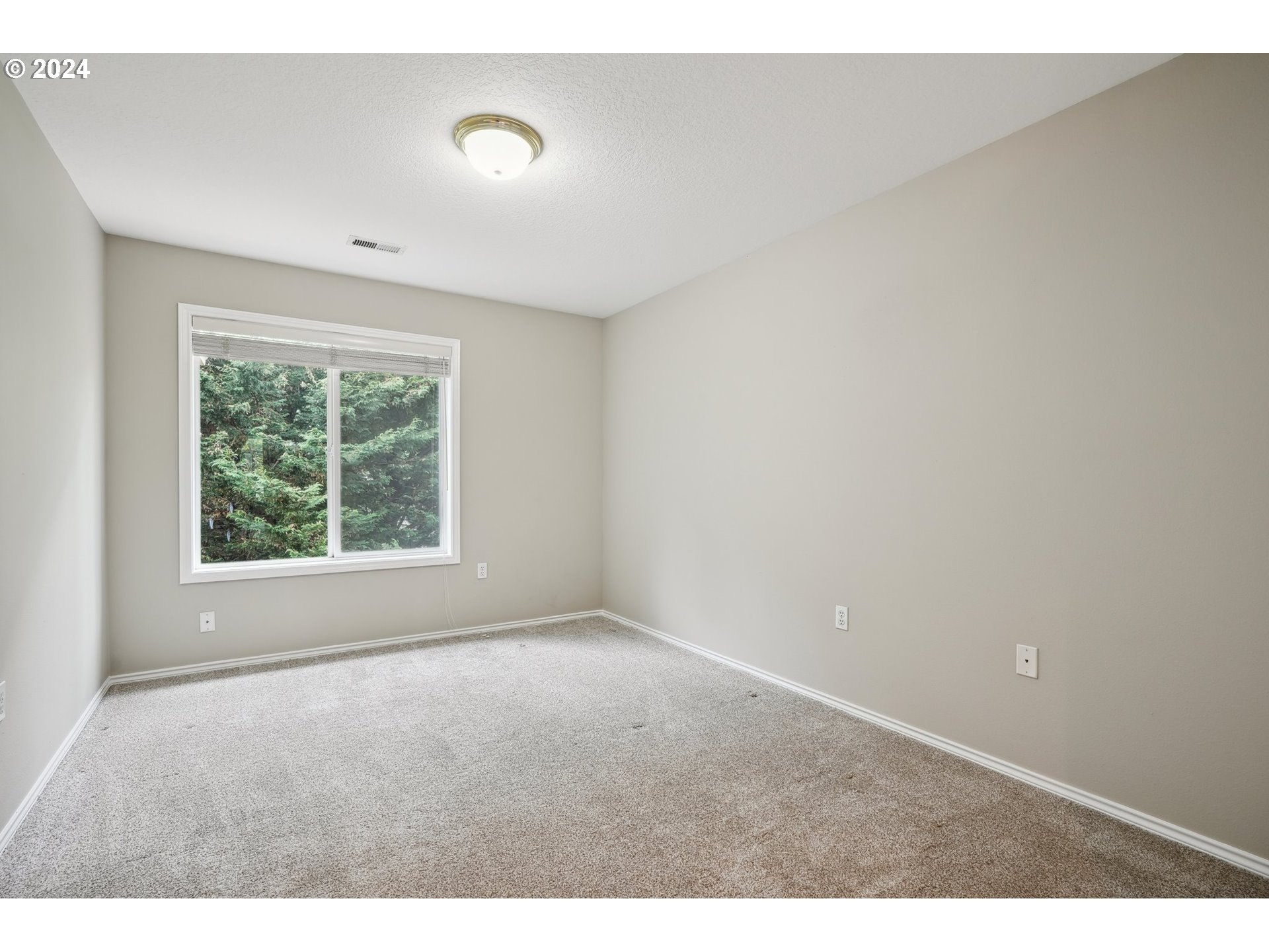 9267 Southwest 83rd Place Portland, OR 97223 - Photo 29 of 44 a view of an empty room with a window