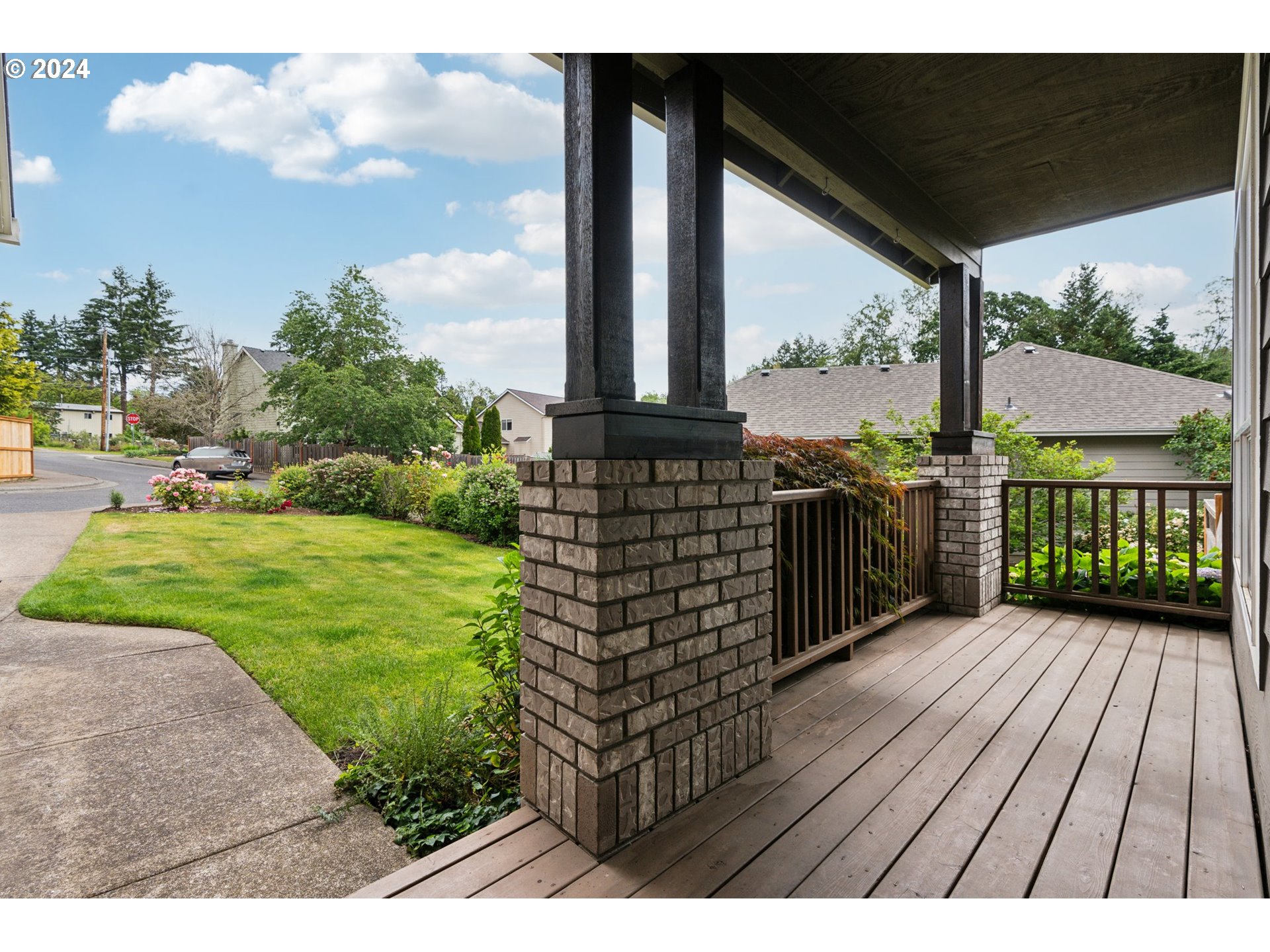 9267 Southwest 83rd Place Portland, OR 97223 - Photo 3 of 44 a view of a porch with wooden floor and fence