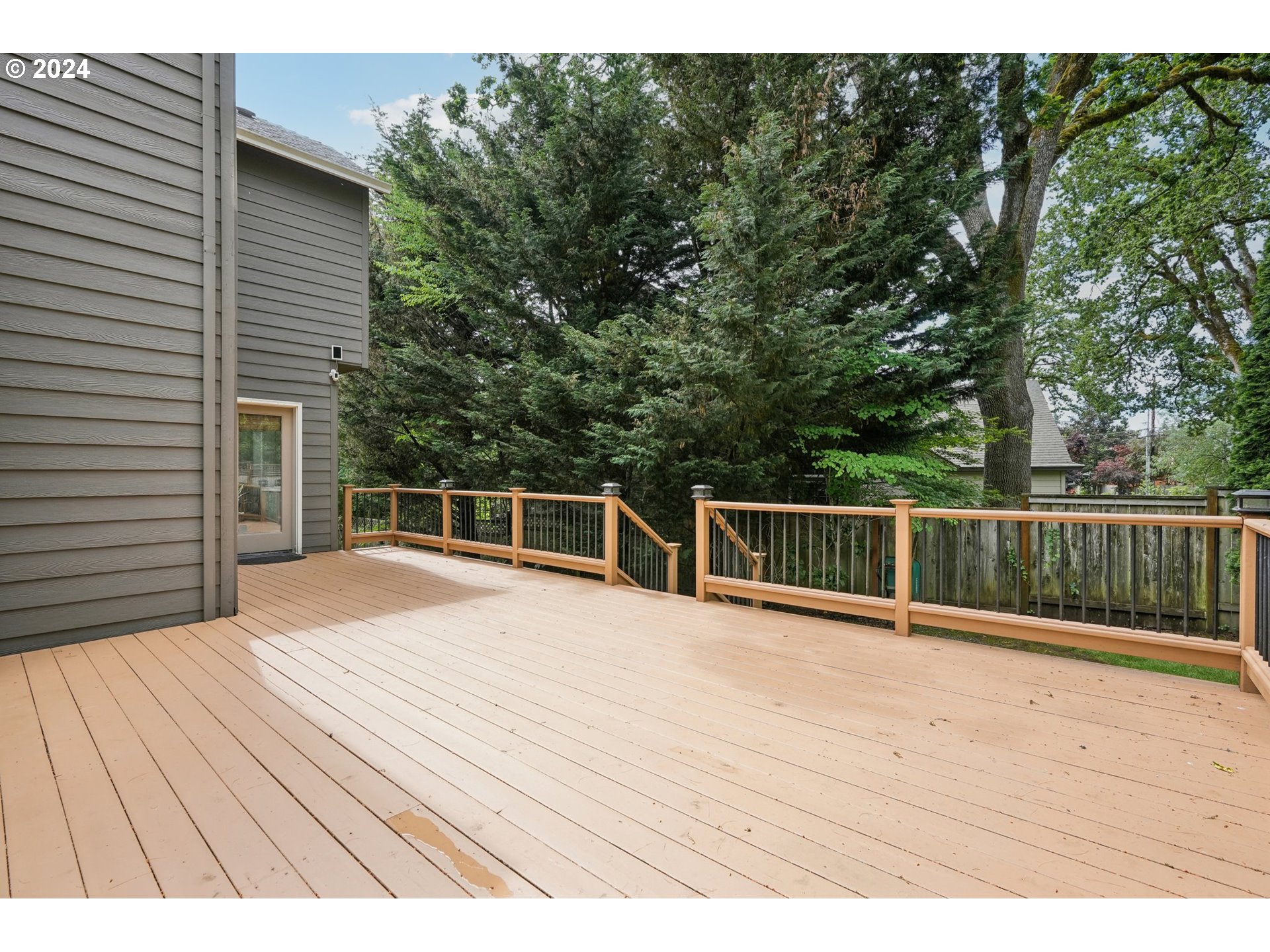 9267 Southwest 83rd Place Portland, OR 97223 - Photo 37 of 44 a view of balcony with wooden floor