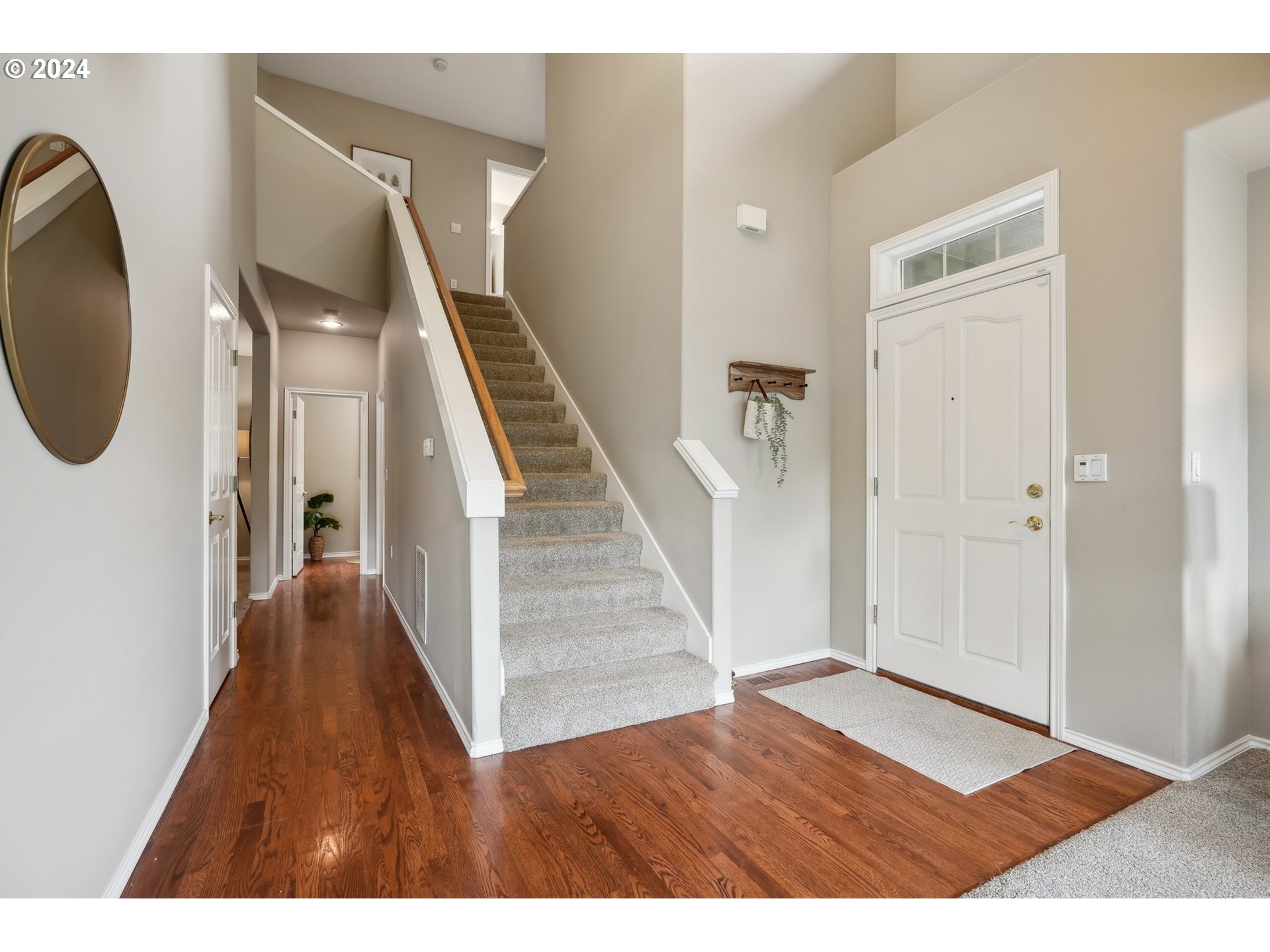 9267 Southwest 83rd Place Portland, OR 97223 - Photo 4 of 44 a view of an entryway with wooden floor