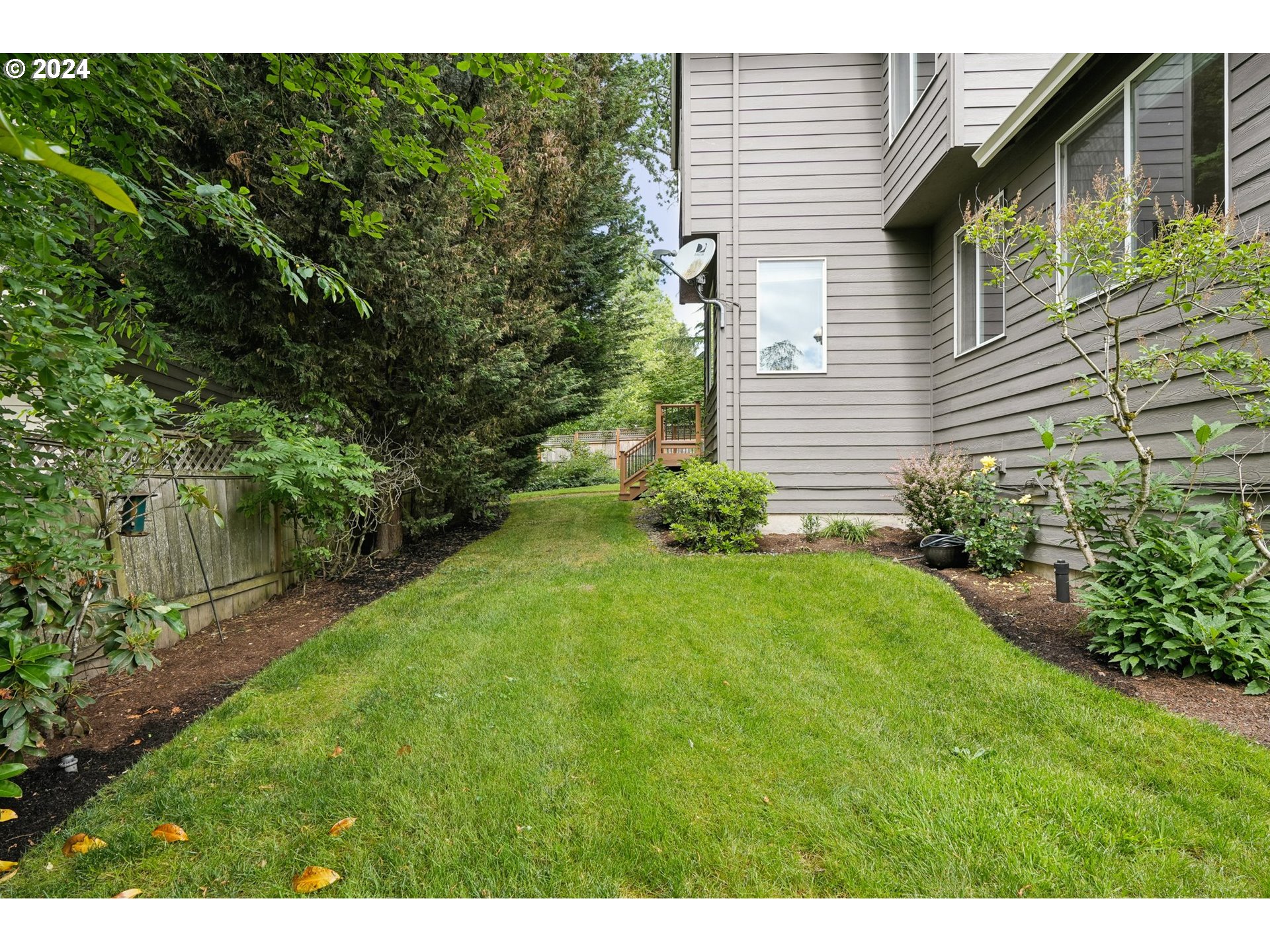 9267 Southwest 83rd Place Portland, OR 97223 - Photo 43 of 44 a view of backyard with potted plants and large tree