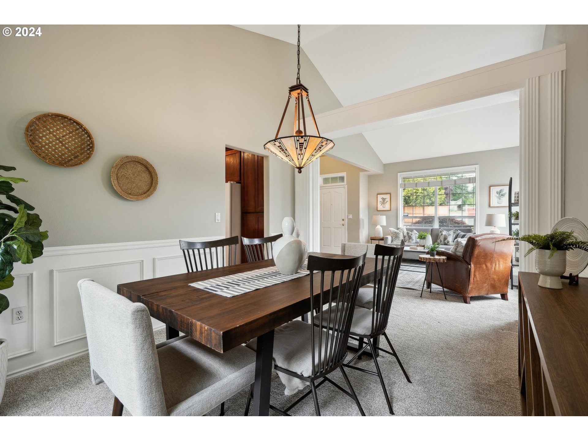9267 Southwest 83rd Place Portland, OR 97223 - Photo 7 of 44 a view of a dining room with furniture and a chandelier