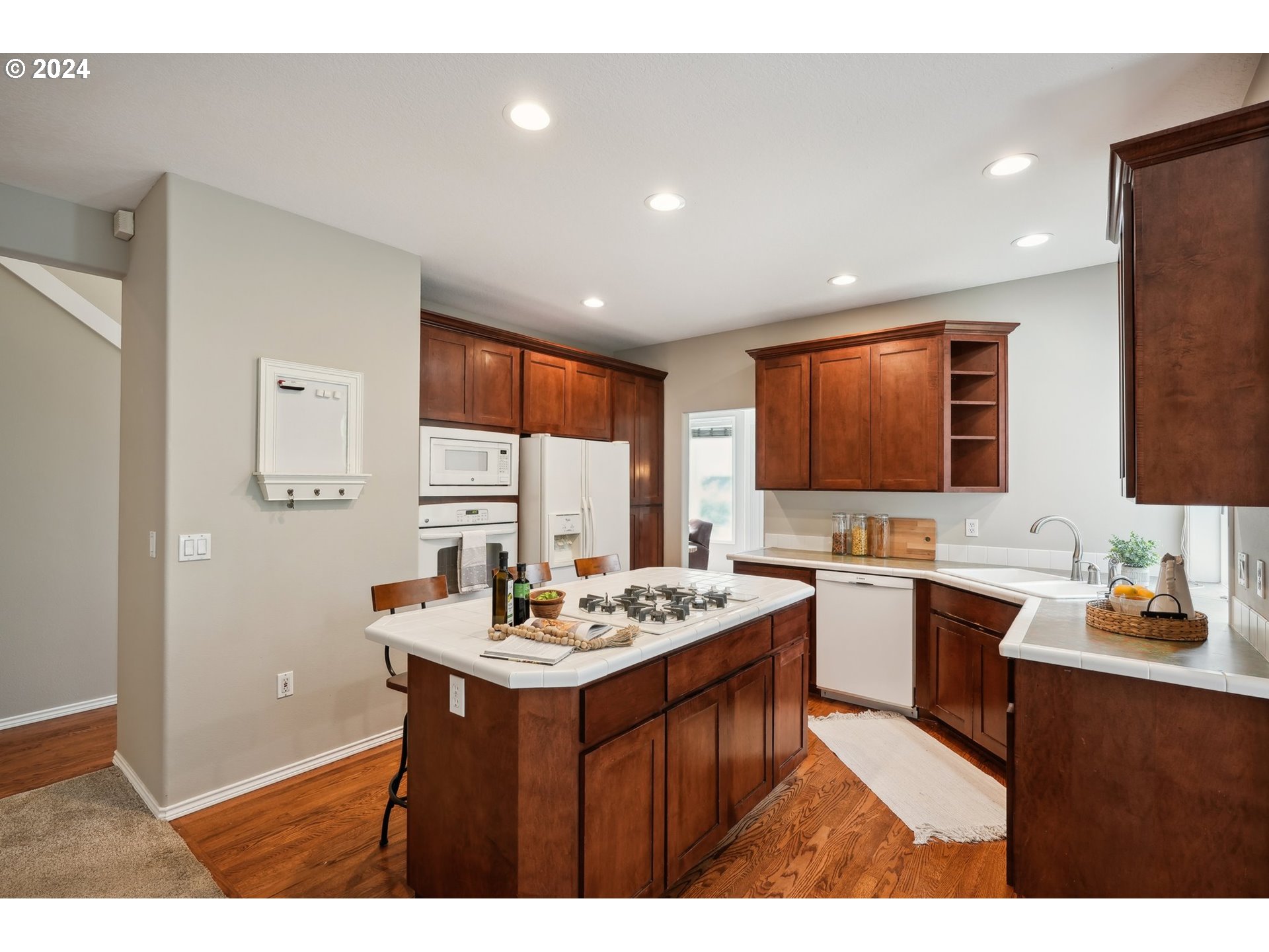 9267 Southwest 83rd Place Portland, OR 97223 - Photo 10 of 44 a kitchen with a sink stove and cabinets