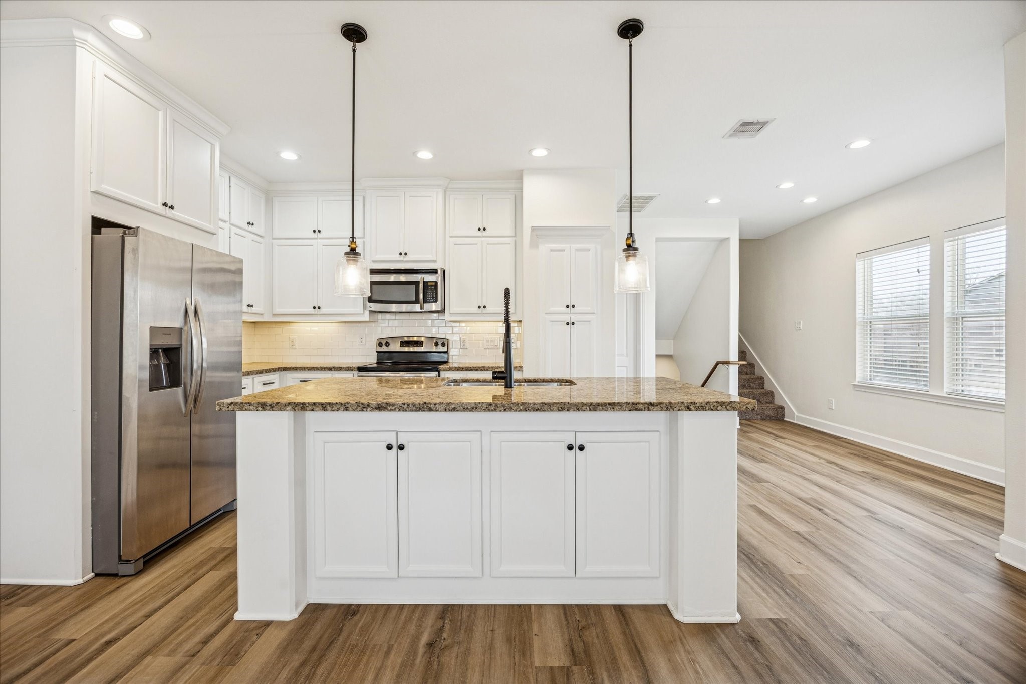 5402 Jonathan Lane Houston, TX 77011 - Photo 4 of 33 This stunning kitchen boasts ample counter space and storage, making it perfect for entertaining and culinary adventures.