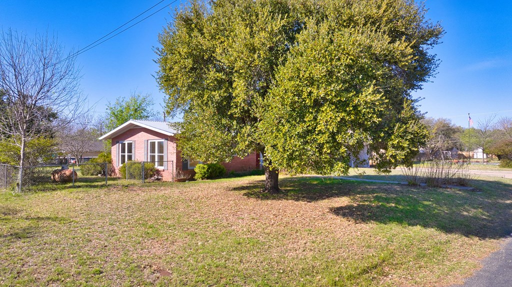 511 East Rainey Street Mason, TX 76856 - Photo 32 of 63 a pathway of a house with a yard