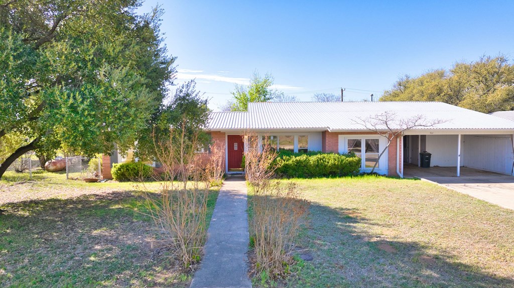511 East Rainey Street Mason, TX 76856 - Photo 39 of 63 a front view of a house with a yard and potted plants