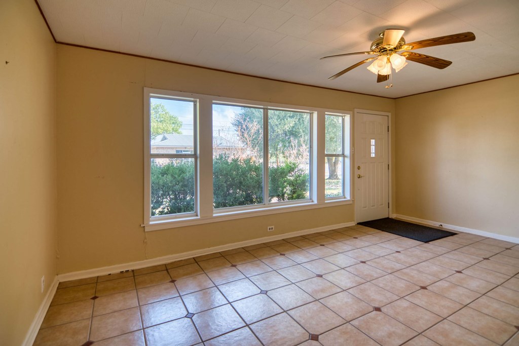 511 East Rainey Street Mason, TX 76856 - Photo 4 of 63 a view of an empty room with a window