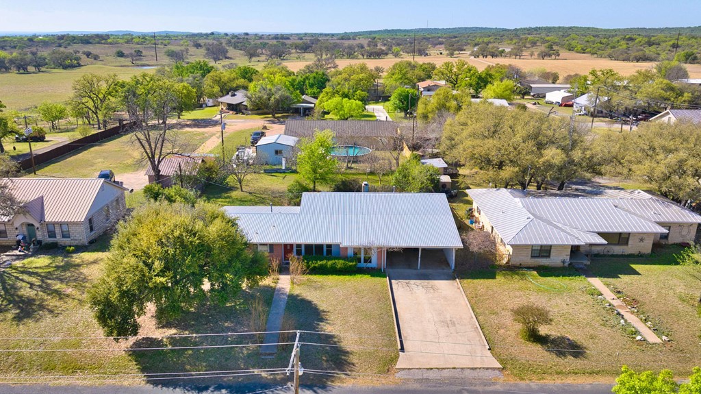 511 East Rainey Street Mason, TX 76856 - Photo 48 of 63 an aerial view of a house with a garden and lake view