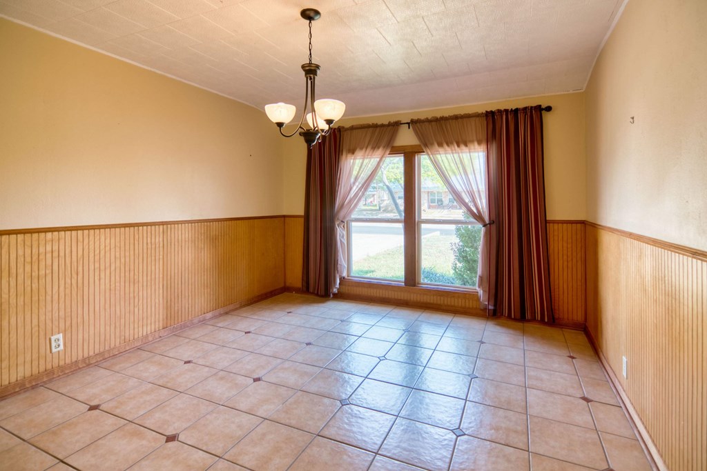 511 East Rainey Street Mason, TX 76856 - Photo 5 of 63 a view of an empty room with a window