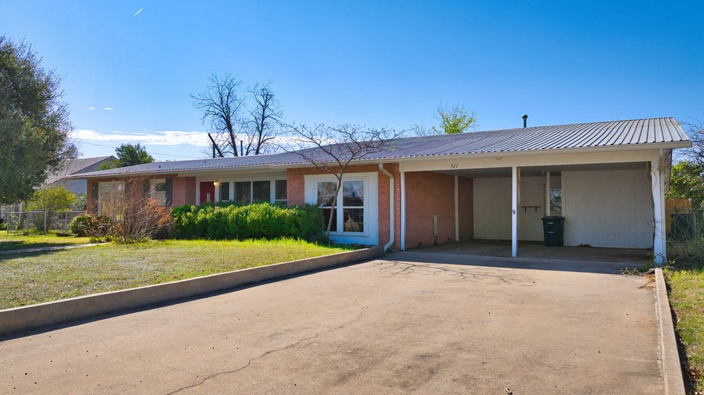 511 East Rainey Street Mason, TX 76856 - Photo 59 of 63 a front view of a house with a yard and potted plants