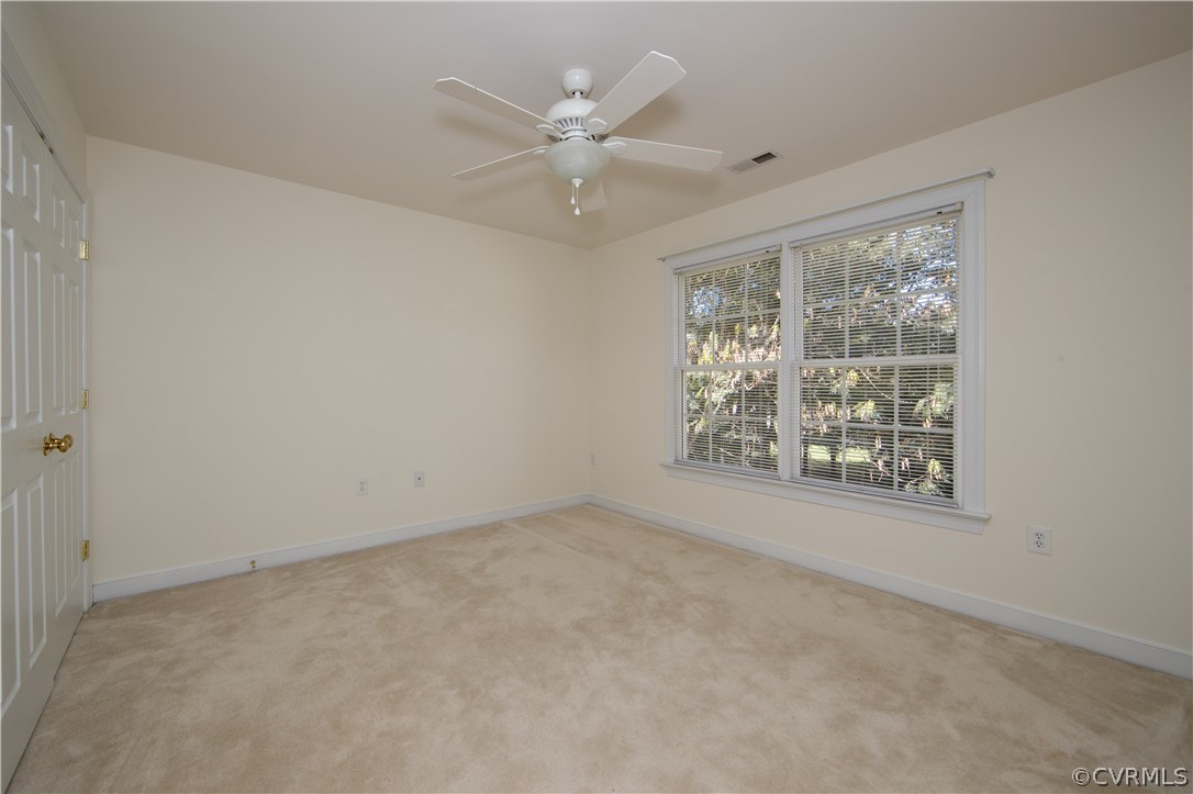 846 Club Ridge Terrace Chester, VA 23836 - Photo 19 of 35 an empty room with windows and fan