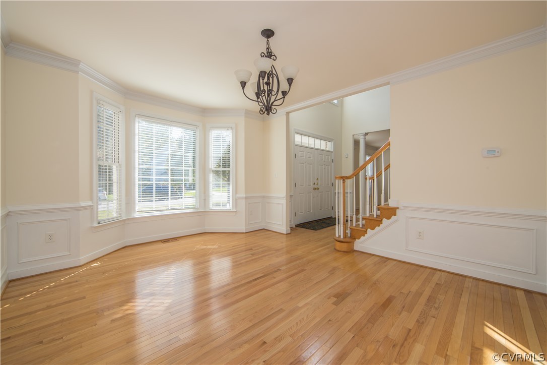 846 Club Ridge Terrace Chester, VA 23836 - Photo 4 of 35 a view of an empty room with wooden floor and a window
