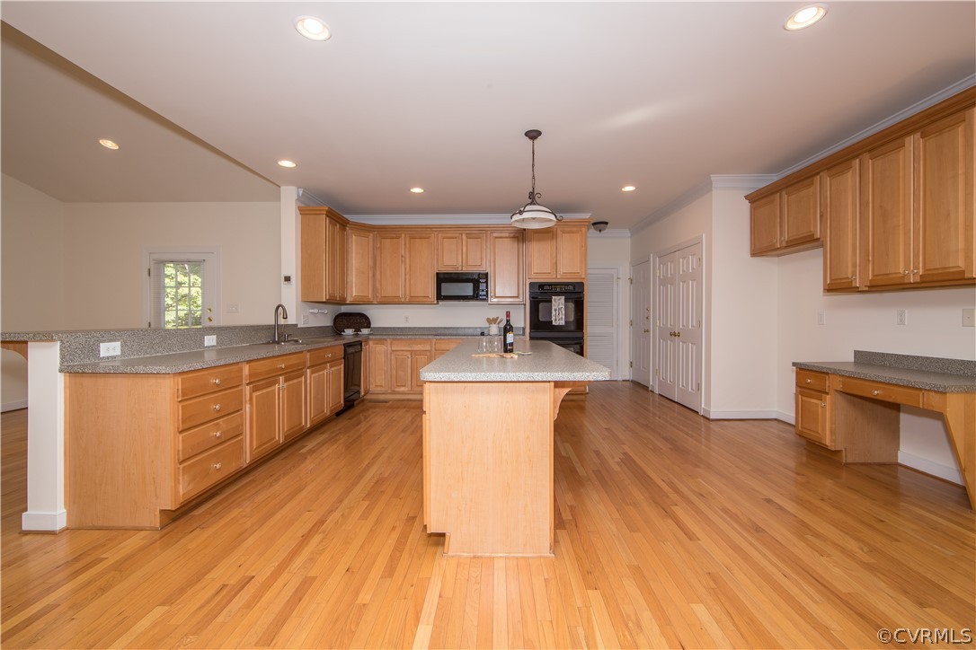 846 Club Ridge Terrace Chester, VA 23836 - Photo 5 of 35 a large kitchen with stainless steel appliances kitchen island granite countertop a stove a sink a refrigerator and white cabinets with wooden floor