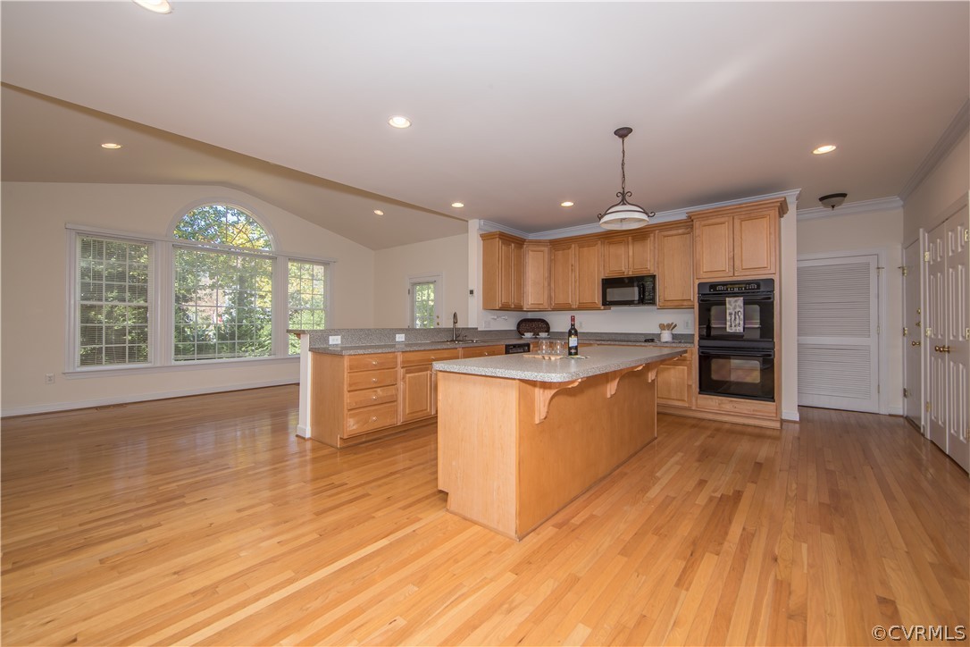 846 Club Ridge Terrace Chester, VA 23836 - Photo 6 of 35 a large kitchen with kitchen island a stove a sink dishwasher and white cabinets with wooden floor