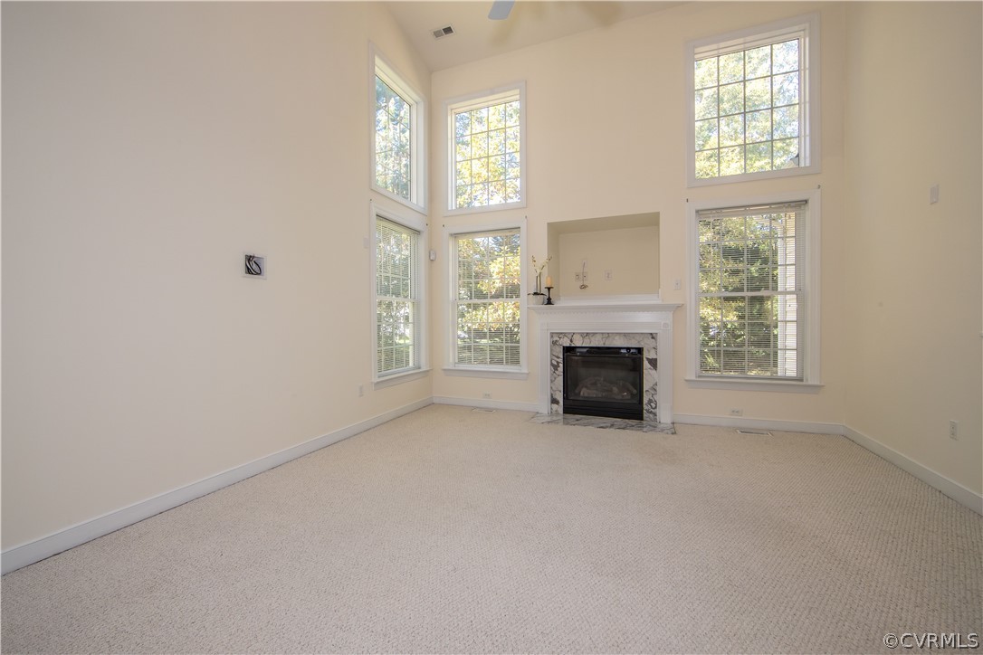 846 Club Ridge Terrace Chester, VA 23836 - Photo 9 of 35 an empty room with windows and fireplace
