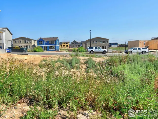 a view of multiple house with a yard