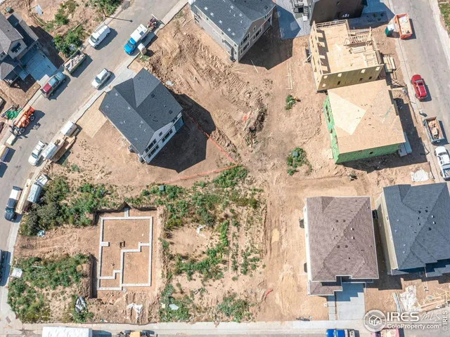an aerial view of houses with outdoor space