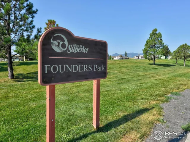 a view of outdoor space with sign board and garden